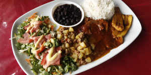 A hearty lunch of rice,beans,vegetables and chicken
