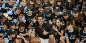 'Cringe-worthy':Novak Djokovic with the ball kids after winning the Madrid Open. Kyrgios isn't his biggest fan.