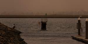 A fisherman at Port Botany as the Southerly winds reach Sydney.