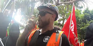 Video tendered to Queensland's CFMEU inquiry shows unionists marching on the Master Builders headquarters in Brisbane in 2022.