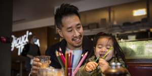 Christopher Ong and daughter Ava,3,enjoy a coffee at Northcote cafe Bicycle Thieves as Melbourne emerges from its latest lockdown.