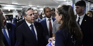 US Secretary of State Antony Blinken speaks to a dual US-Israeli citizen,as he visits a donation centre for victims of the Hamas terror attacks.