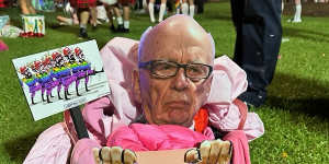 In the pink:A cut-out of Rupert Murdoch in a basket of “pink washing” at the 2023 Mardi Gras.