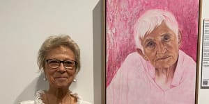 Artist and art teacher Kathy Sullivan with Tradewind Annie,her portrait of Anne Collins selected as a finalist for this year’s Brisbane Portrait Prize. 