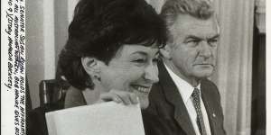 Senator Susan Ryan with Prime Minister Bob Hawke as she holds the Affirmative Action Implementation Manual,June 1984.