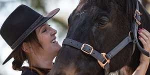 Elizabeth Milinkovic with an ex-racing thoroughbred horse named Danny.