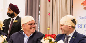 In happier times:former prime minister Scott Morrison and then immigration minister Alex Hawke at a Sikh community centre in Melbourne during the 2022 election campaign.