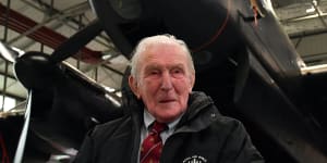 Johnny Johnson,the last survivor of the original Dambusters of 617 Squadron,sits beneath an Avro Lancaster bomber at RAF Coningsby,Lincolnshire.