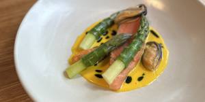 Salmon with asparagus and mussels at La Cachette,which writes new menus every three weeks.