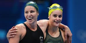 Bronze medalist Emily Seebohm and gold medalist Kaylee McKeown celebrate after the 200-metre backstroke final. 