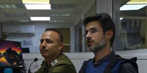 The mayor of Kiryat Shmona in northern Israel,Avichai Stern (right),in the city’s command centre. Kiryat Shmona is four kilometres from the Lebanon border. 