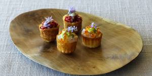 Pie tee shells of carrot waste filled with delicately smoked salmon.