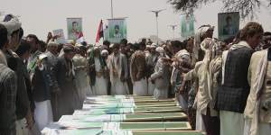 Yemeni people attend the funeral of victims of a Saudi-led airstrike,in Saada,Yemen.