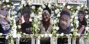 Photographs of victims of a mass shooting at a gay nightclub are displayed at a memorial on November 22 in Colorado.