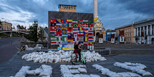 Flags are displayed from around the world and sandbags spell out “HELP” in Kyiv’s Maidan Square on June 25.