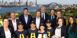 (L to R) Shannon Parry of the Wallaroos,Wallaroos head coach Jay Tregonning,Rugby Australia chair Hamish McLennan,Rugby Australia CEO Andy Marinos,RA president David Codey,Phil Kearns of the bid team,World Rugby CEO Alan Gilpin,Josephine Sukkar and Mahalia Murphy of the Wallaroos pose with junior rugby players during an Australian Rugby World Cup bid event at Taronga Zoo.
