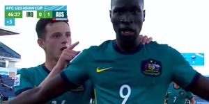 Alou Kuol celebrates his scorpion kick goal for the Olyroos in the Asian Cup.