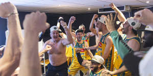 Celebrations for the Tasmania JackJumpers NBL title win hit full stride,with shirtless coach Scott Roth leading the way.