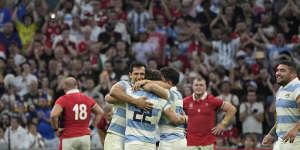 Argentina players celebrate after defeating Wales in the Rugby World Cup quarterfinal match.