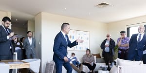 Auctioneer Clarence White in action at 25/40 Maria Street,Petersham.