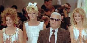 Karl Lagerfeld with models Cindy Crawford,Linda Evangelista and Claudia Schiffer after his spring-summer show for Chanel in Paris,1995.