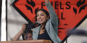 Democrat Alexandria Ocasio-Cortez speaks at a New York rally to end the use of fossil fuels.