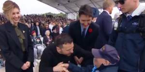 Ukrainian President Volodymyr Zelensky embraces a veteran of D-Day at the 80th anniversary of the invasion,as his wife Olena and Canadian PM Justin Trudeau look on.