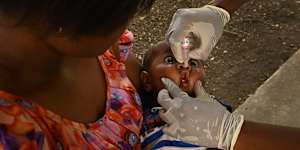 Four-month-old Zyven receives his routine polio immunisation at Tokorara Urban Health Clinic in Port Moresby. The clinic is one of dozens gearing up for a third vaccination campaign since a polio outbreak was declared last May.