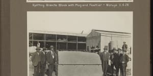 A worker splits the granite block with a plug and feather,a three-piece tool set.