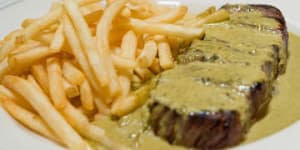 Signature dish:Steak,green salad with dijon vinaigrette and bottomless fries.