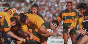 The Wallabies in an alternate strip take on Romania at the 1995 Rugby World Cup.