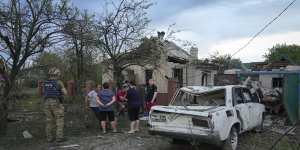 Residents gather near houses damaged by a Russian rocket attack in Pokrovsk,Donetsk region,Ukraine,on Wednesday.