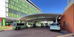 Ambulances wait outside of the emergency department at Sir Charles Gairdner Hospital. 