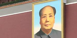 The image of Mao looms in Tiananmen Square.
