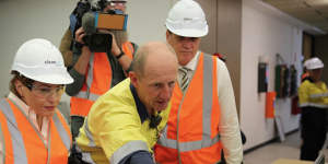 Energy Minister Dr Anthony Lynham and Treasurer Jackie Trad inside CleanCo's hydroelectricity plant at Wivenhoe Dam.