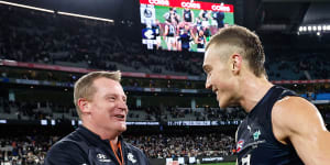 Blues coach Michael Voss celebrates with Patrick Cripps after his side’s win over Collingwood on Friday.