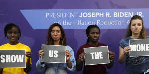 From left:Vanessa Nakate,of Uganda,Mitzi Jonelle Tan,of the Philippines,Precious Kalombwana,of Zambia,and Dominika Lasota,of Poland,hold signs that read “show us the money” at the US Centre at the COP27 UN Climate Summit.