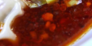 San xian dumplings in Sichuan chilli oil.