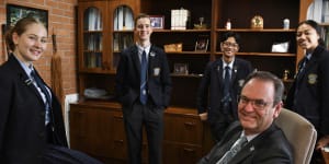 Steve Lo Cascio,principal of Mount Carmel Catholic College in Varroville,with students