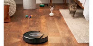 The Roomba Combo J7+ vacuums and mops,with its mop pad able to be stored on top of the unit when not needed.