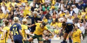 Madelen Janogy of Sweden attempts to head the ball through for a goal. 