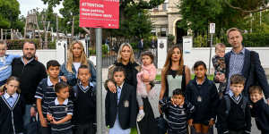 Parents of Caulfield Grammar students drop off their kids on Wednesday morning.