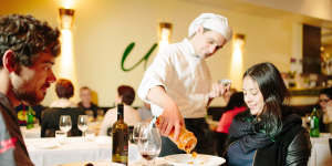 Head chef Fabio Durpetti serves the just-mixed schekerata at a couple's table. 