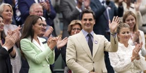Roger Federer,in the Royal Box next to Britain’s Kate Princess of Wales,is applauded at Centre Court.