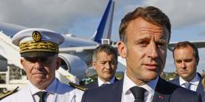 French President Emmanuel Macron speaks after stepping off his plane in New Caledonia on Thursday.