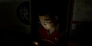 JD logistics courier Shi Hailong at work late at night in Beijing in June.