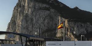 A Spanish flag flies on top of the customs house on the Spanish side of the border with the British overseas territory.