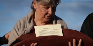 Pat Anderson from the Referendum Council with a piti holding the Uluru Statement from the Heart in May 2017.