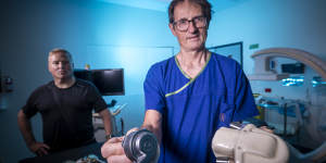 Professor David Kaye,director of cardiology at The Alfred with some of the first heart pumps used,and patient Peter Callinan,whose heart pump is top of the range right now.