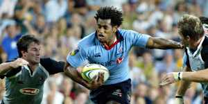 Lote Tuqiri tries to get into the clear during a blockbuster Waratahs clash against the Sharks in 2004,when the Bundy Bar was a hive of activity.